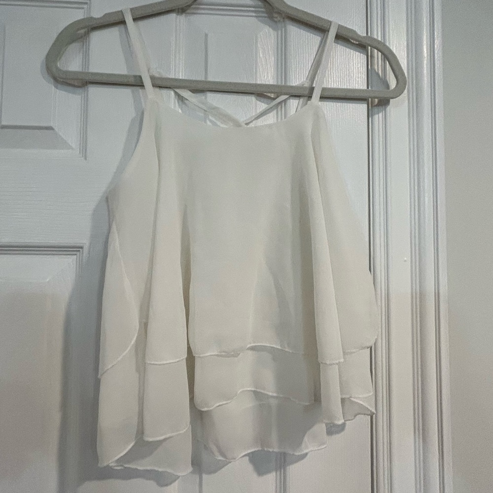 Size medium white ruffle blouse with cross back